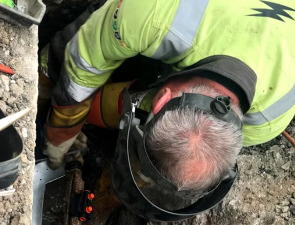 Employee working on site excavations